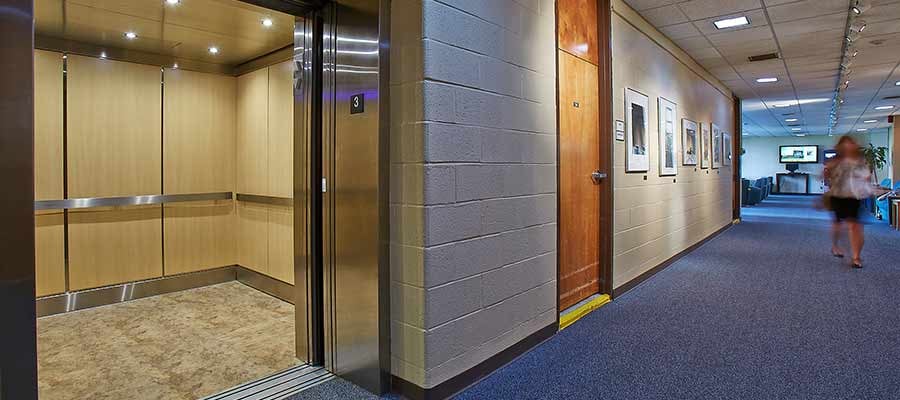 Hallway with an open elevator.