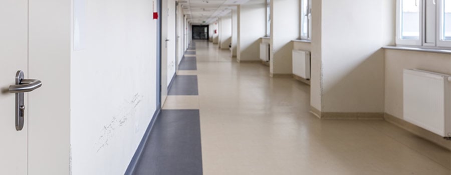 A hallway with scuff marks on the walls