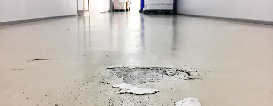 Tile hallway floor with broken tile