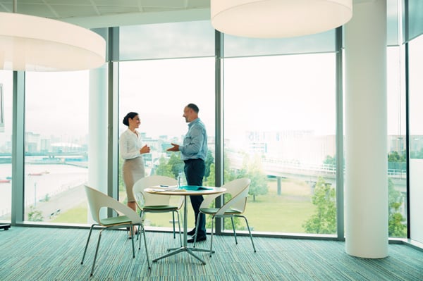  An office or professional meeting area with large open windows using Inpro shades to allow for natural light and keep the view.