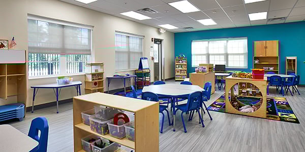 A classroom with biophilic window design that allows natural light to be balanced appropriately for optimal learning.