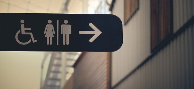 A bathroom directional sign.