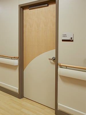 Hospital room door with a Palladium® Designer Kickplate