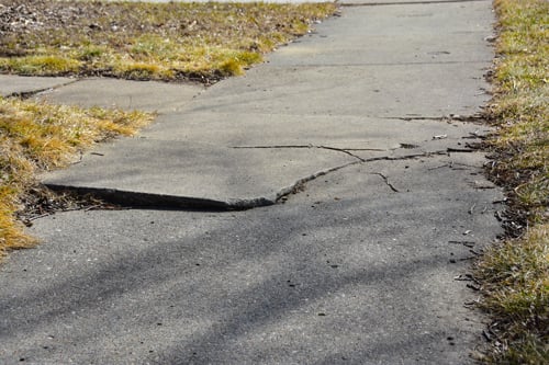 A cracked sidewalk.