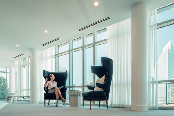 Inpro drapery hung in the windows of a lobby or business meeting area that adds a wellness feeling and dressed to impress.