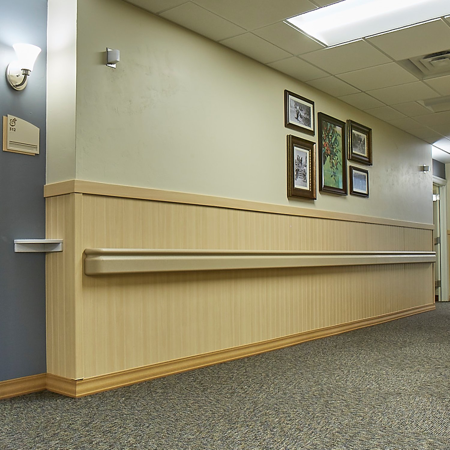 Rigid vinyl beadboard in light wood grain finish in corridor