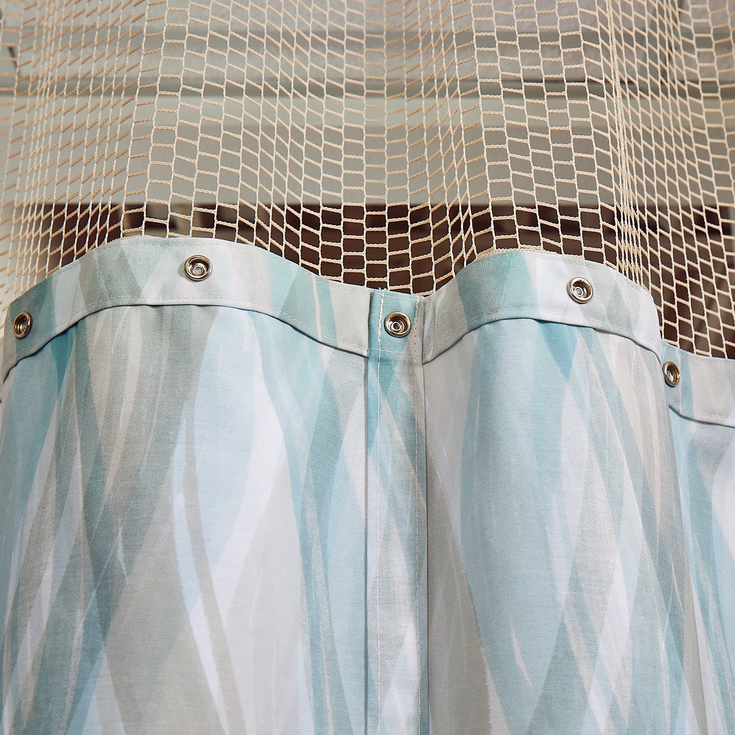 Close-up view of EZE-Swap Cubicle Curtain closed snaps and mesh