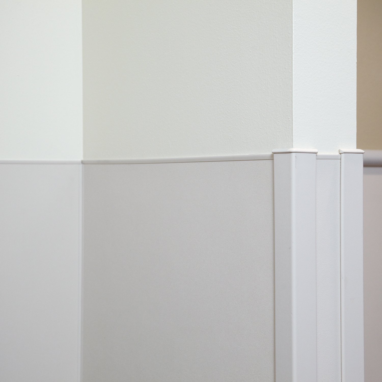 Off white rigid vinyl sheet with matching trim and corner guards