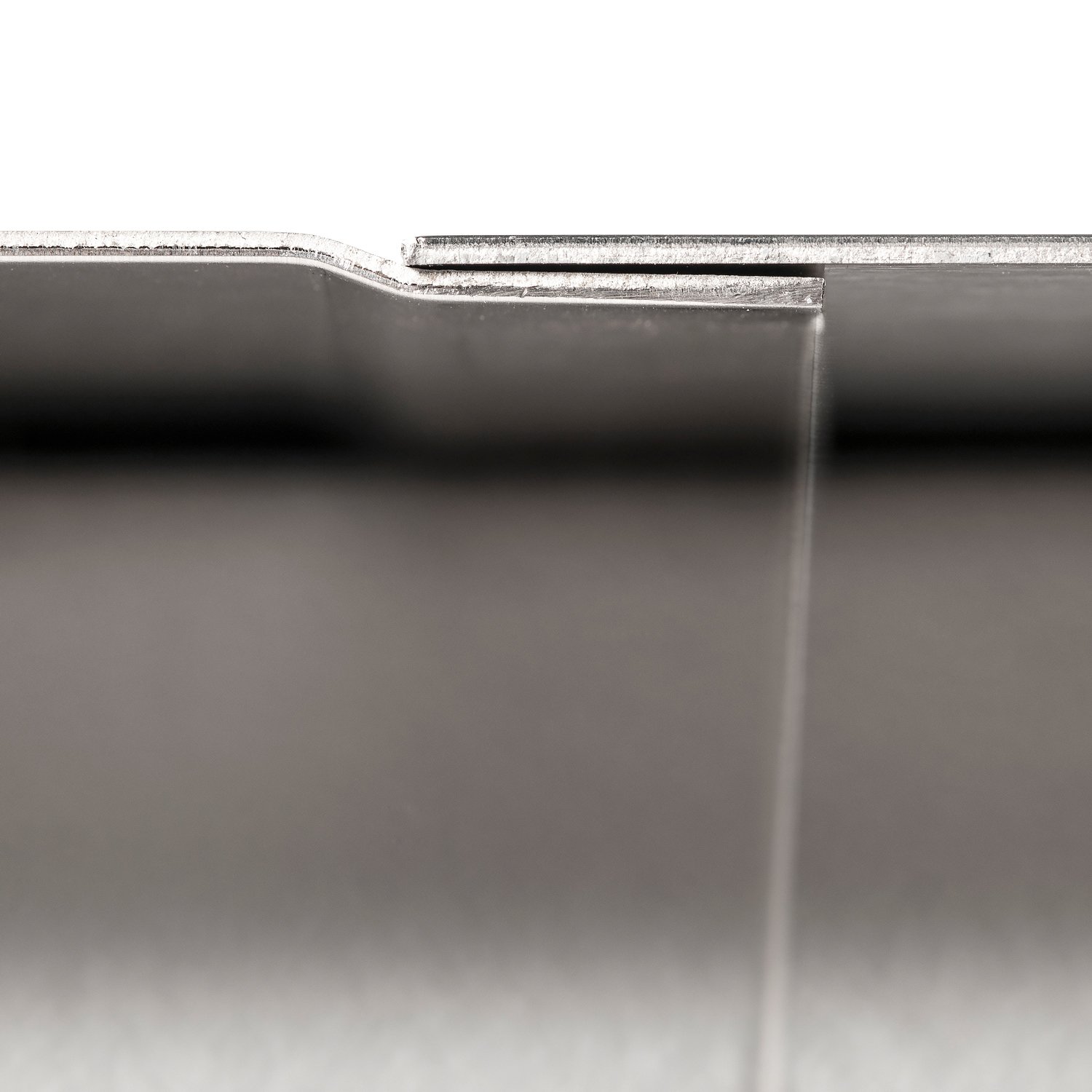 Close up view of stainless steel wall panel overlap join